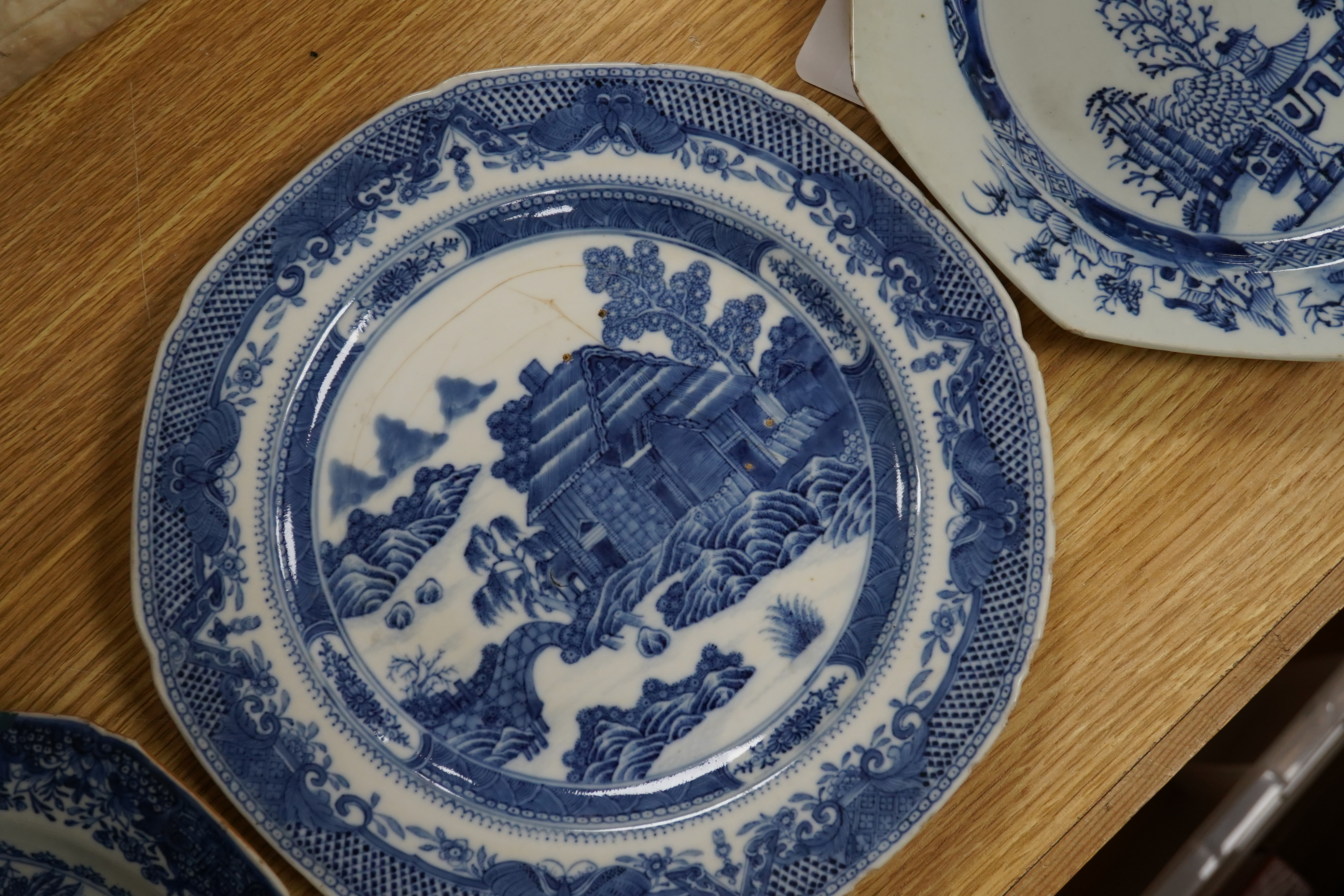 Five 18th century Chinese Export blue and white plates, largest 24cm diameter. Condition - all have varying amounts of damage